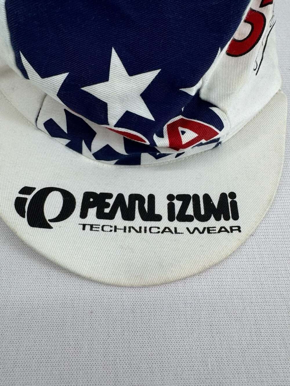 Pearl Izumi USA Cycling Cap White Red Blue Technical Wear
